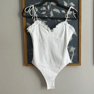 Adorable bodysuit from revolve. Never worn